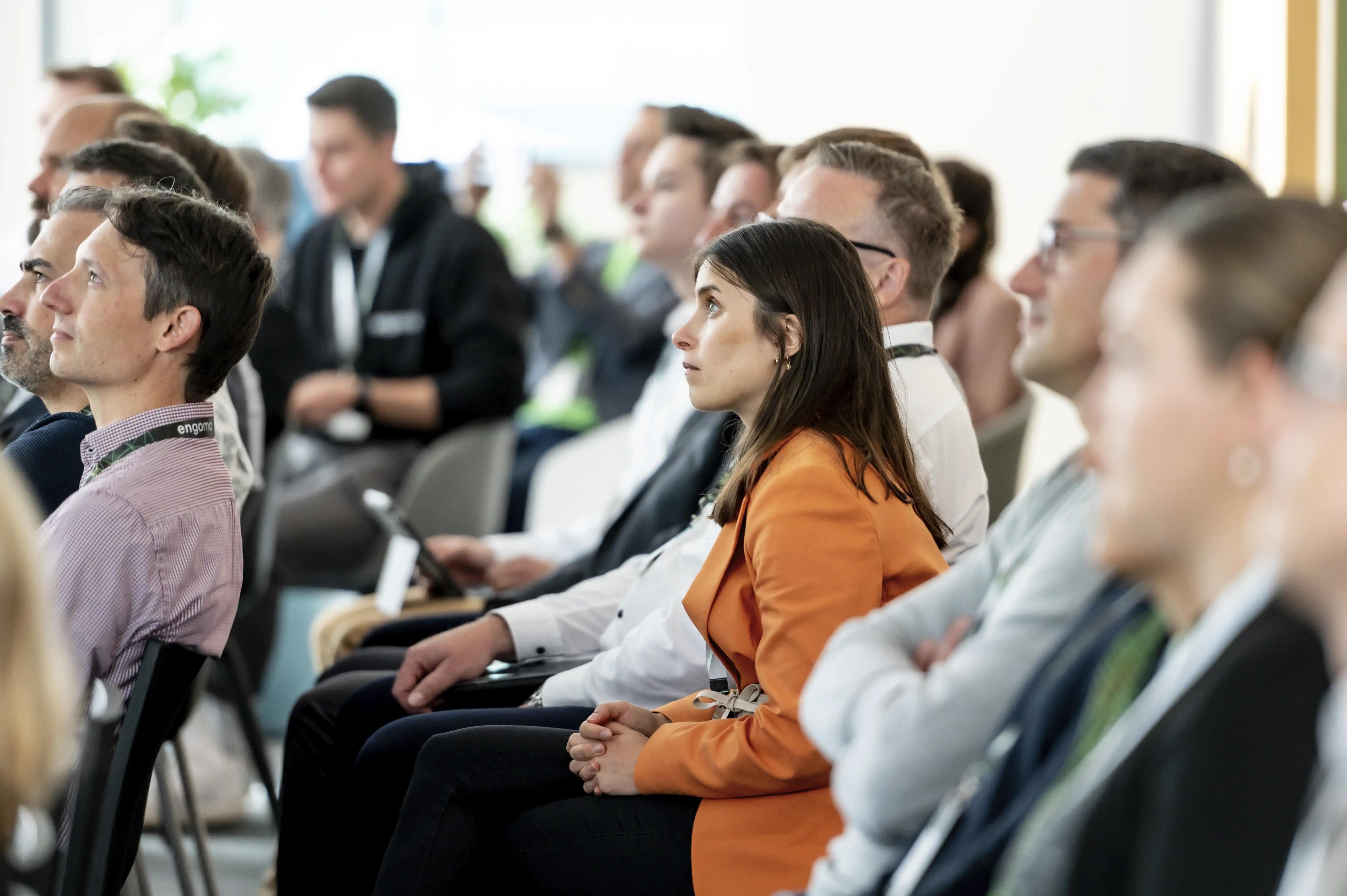 Group of attentive participants at engomo’s event – symbolizing customer satisfaction and digital transformation.