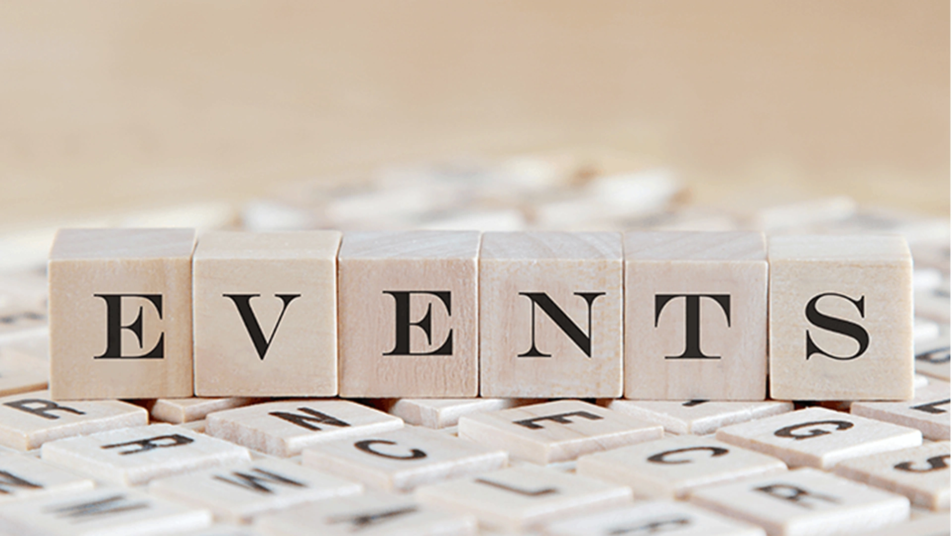 Stockfoto von Bausteinen, die das Wort EVENTS buchstabieren