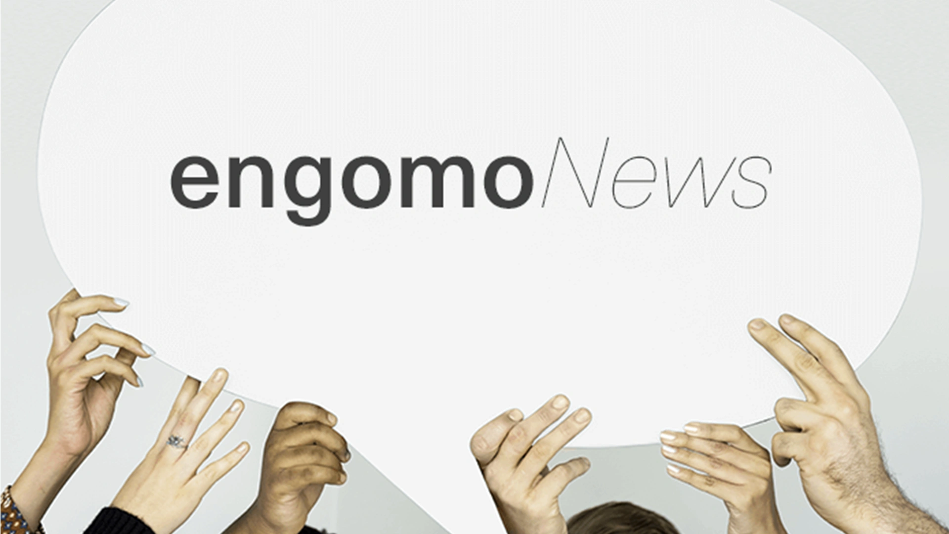 Stock photo of hands holding a speech bubble with "engomoNews" written in the center.